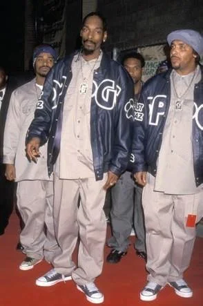 Snoop Dogg and his crew in matching khaki Dickies work shirts and baggy work pants in the 1990s