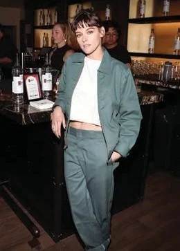 Guest at an event wearing a matching teal Dickies Eisenhower jacket and work pants